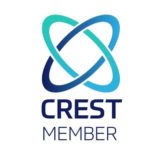 CREST Member logo with intertwining turquoise and blue rings forming an atom-like symbol